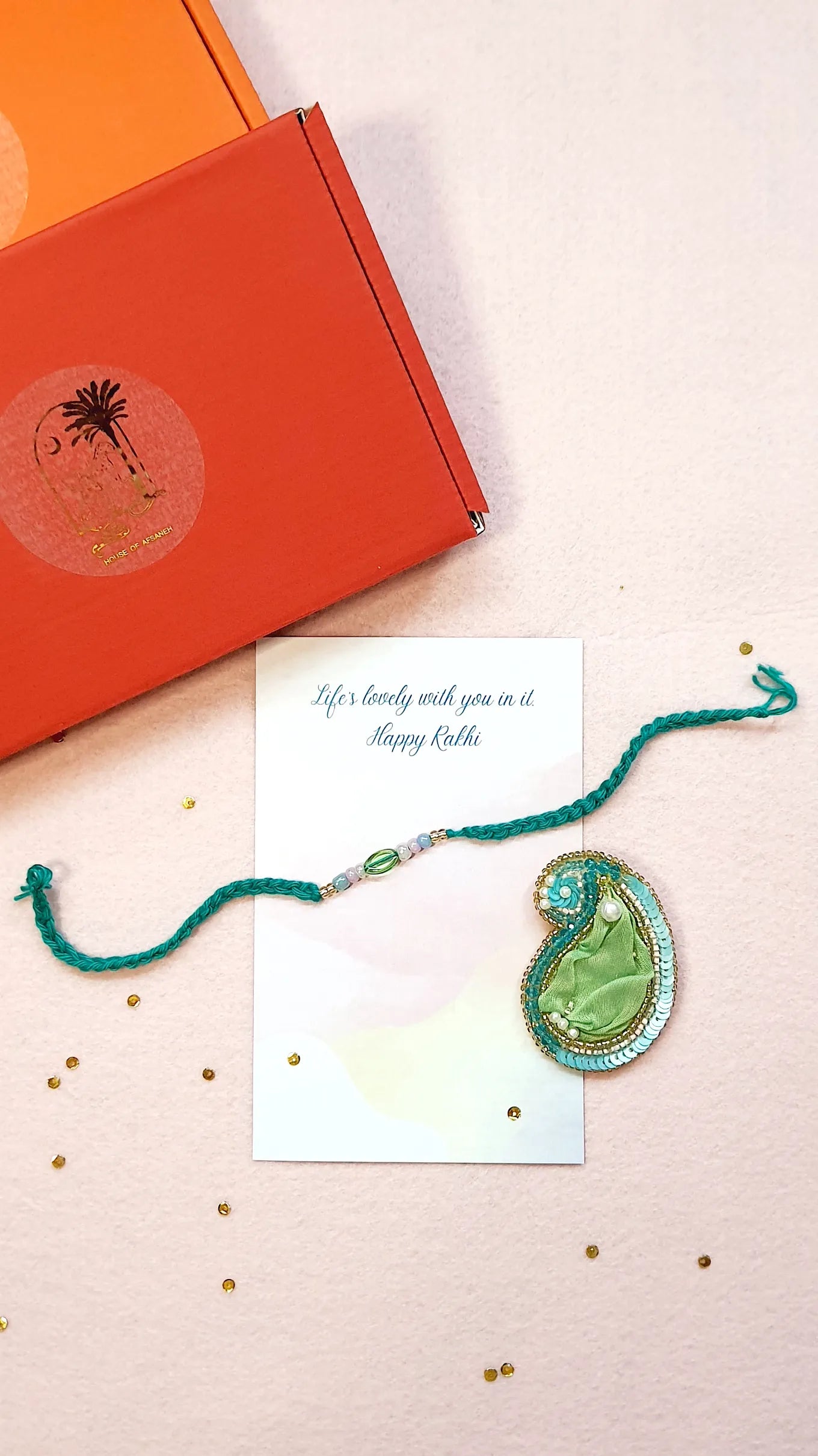 Emerald Rakhi & Amra Brooch