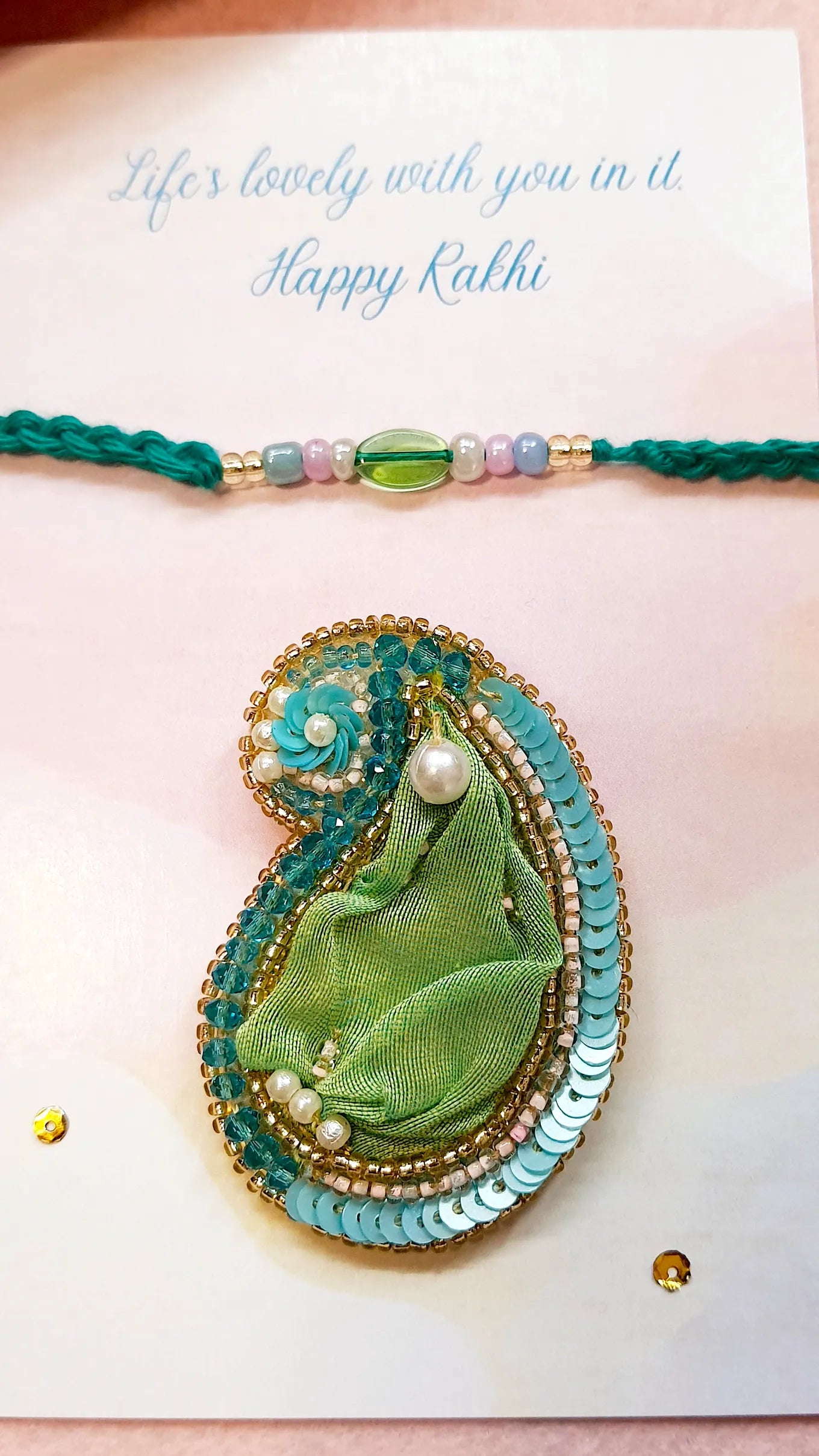 Emerald Rakhi & Amra Brooch