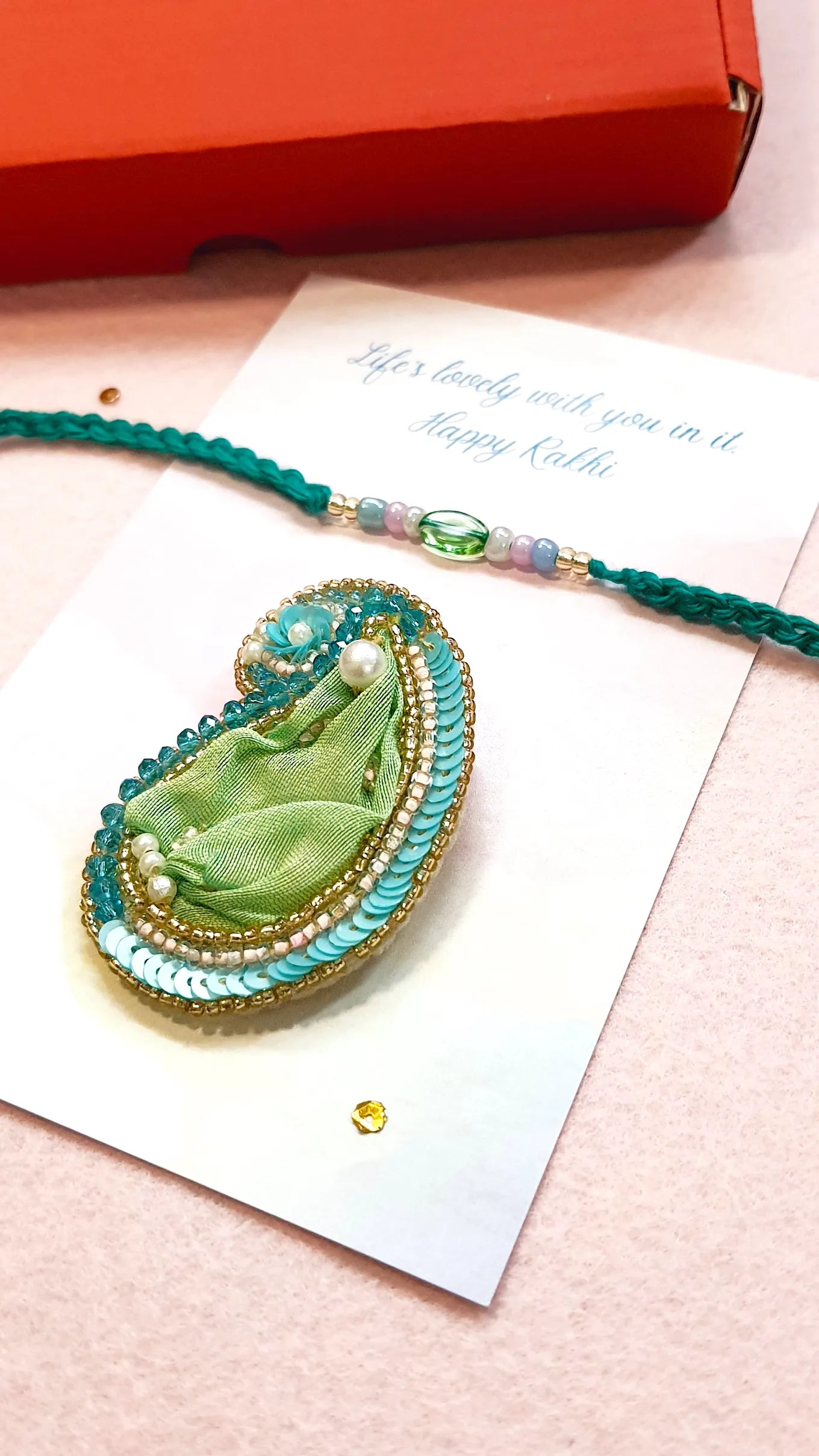 Emerald Rakhi & Amra Brooch
