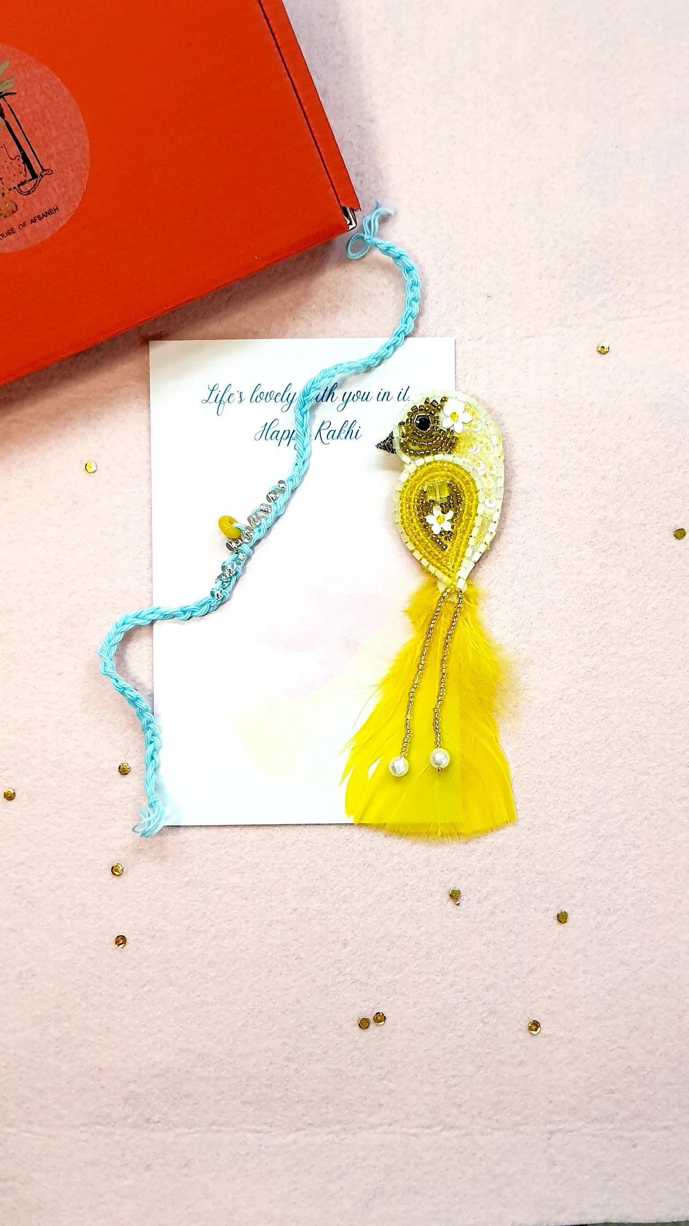 Crown Rakhi & Yellow Sparrow Brooch