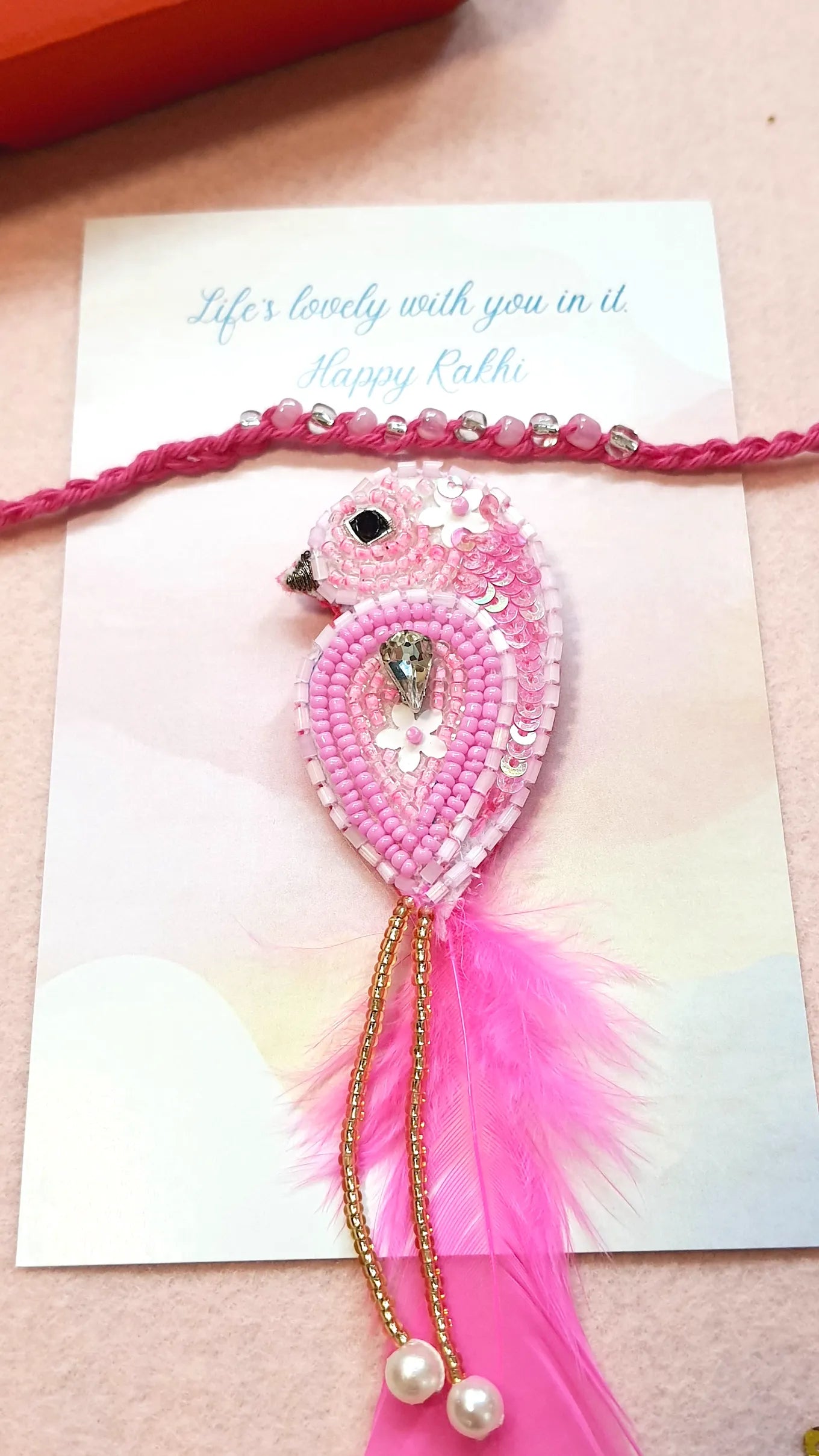 Shimmer Rakhi & Magenta Sparrow Brooch