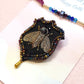 Blue Nile Rakhi & Cairo Bee Brooch